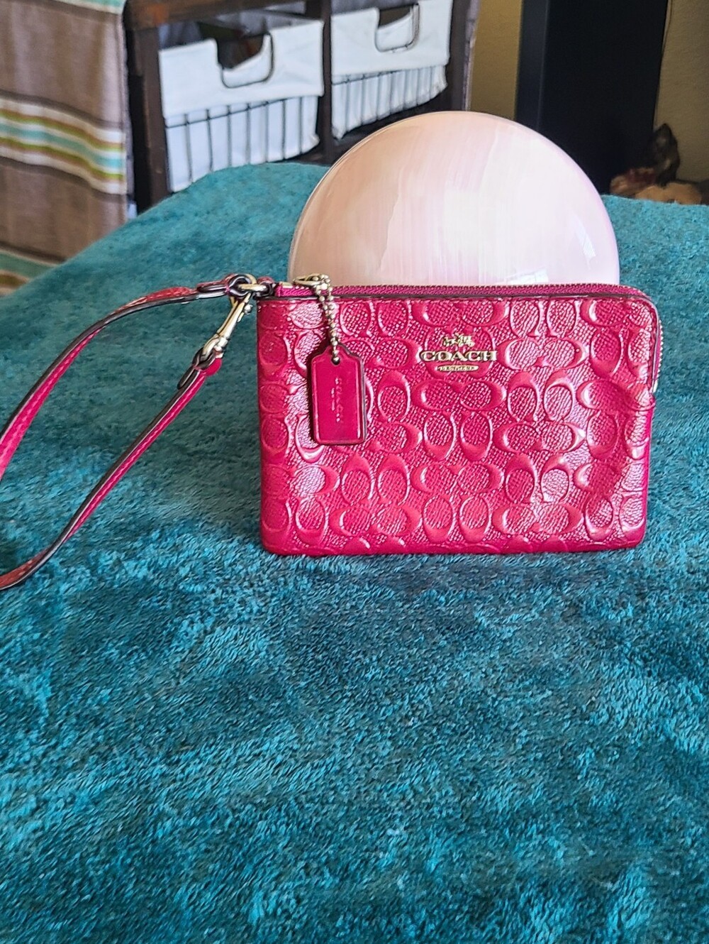 Coach Signature Embossed Wristlet In Pink Patent Leather